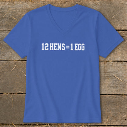 Royal blue V-neck T-shirt with the white text 12 HENS = 1 EGG displayed on the chest, lying flat on a wooden surface.