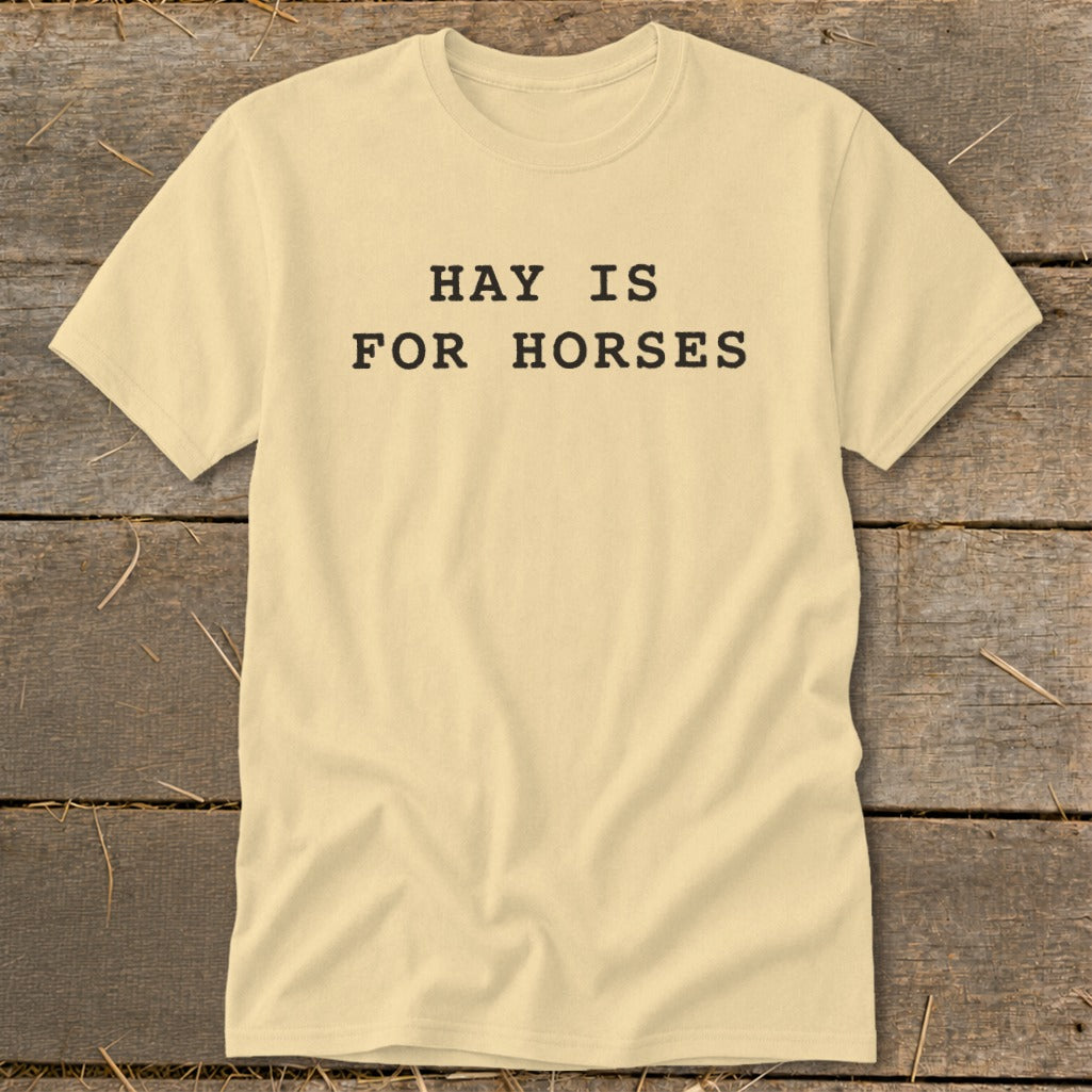 Light yellow t-shirt with black text reading "HAY IS FOR HORSES".