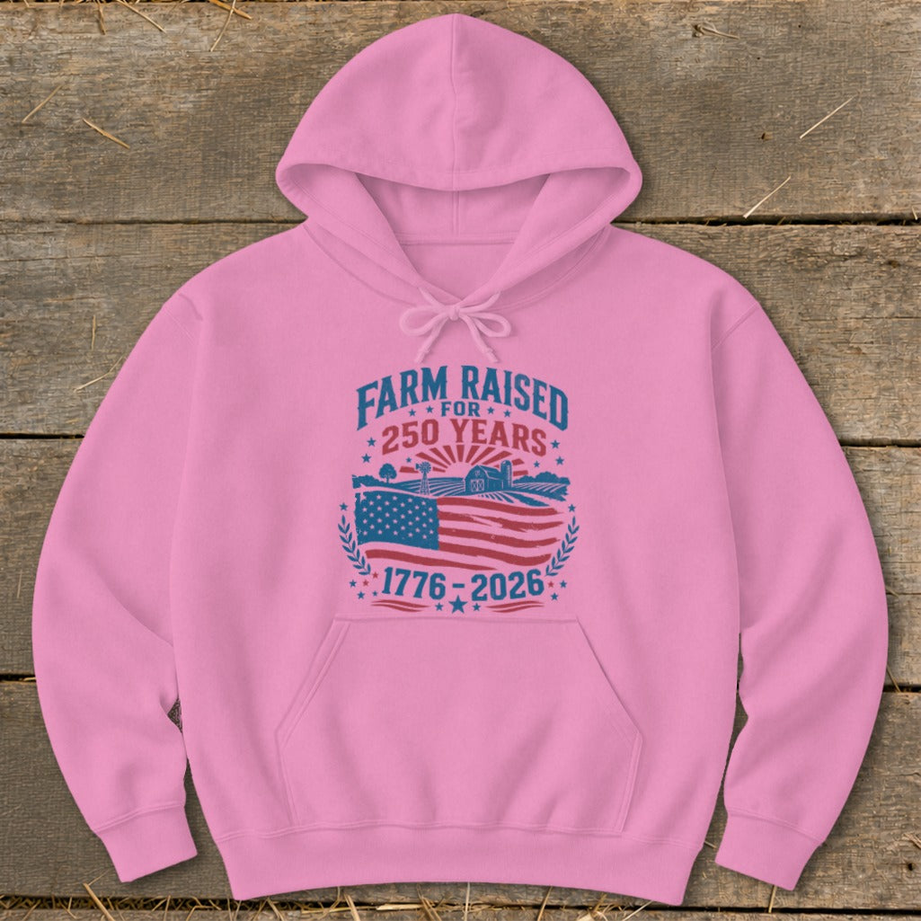Pink hoodie with "Farm Raised for 250 Years" and American flag graphic.
