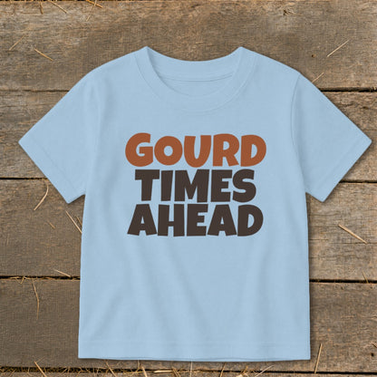 Light blue t-shirt with text "GOURD TIMES AHEAD" in brown and orange.
