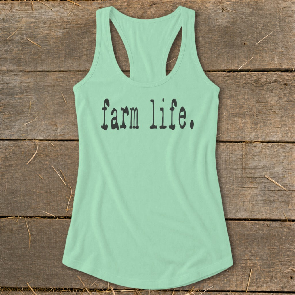 Mint green racerback tank top with black text that reads "farm life."