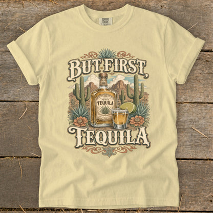 T-shirt with "But First Tequila" graphic featuring a desert scene, tequila bottle, and shot glass.