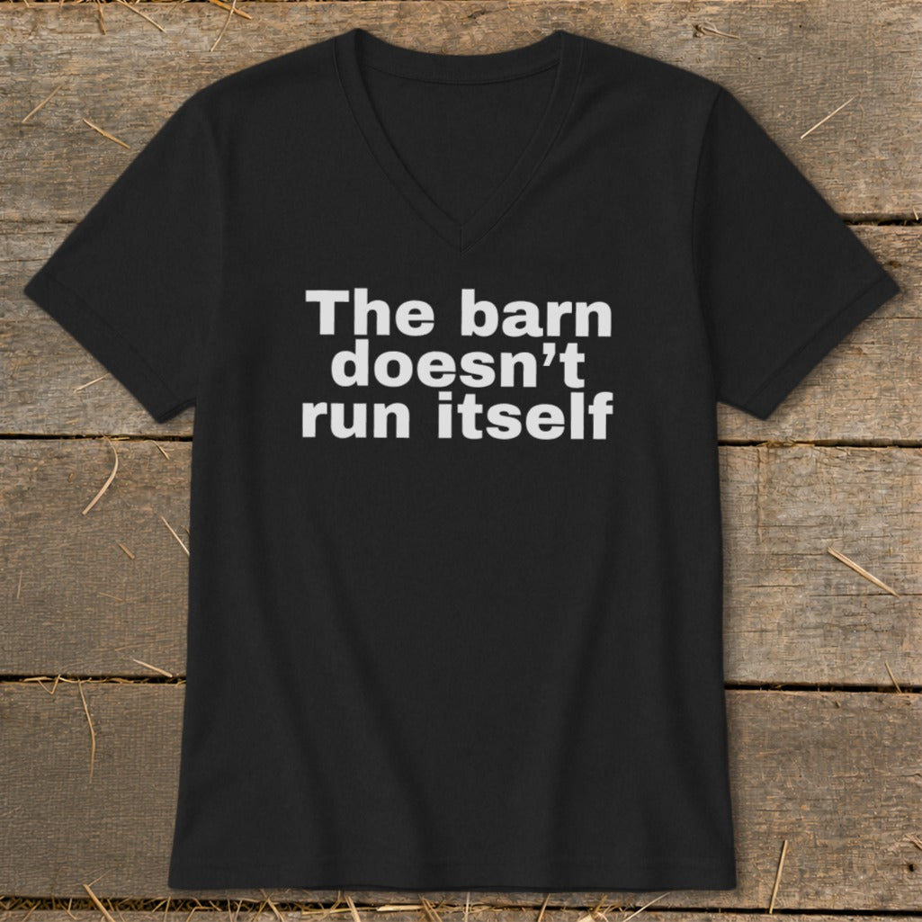 Black t-shirt with white text reading "The barn doesn't run itself."