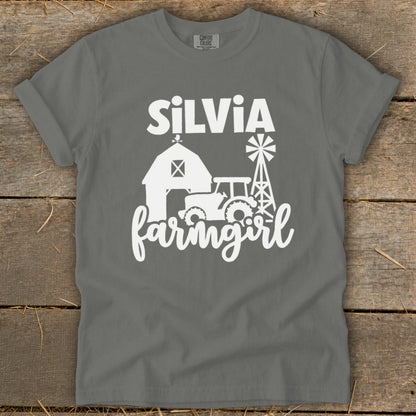 Gray t-shirt with white text "Silvia Farmgirl" and farm graphics.