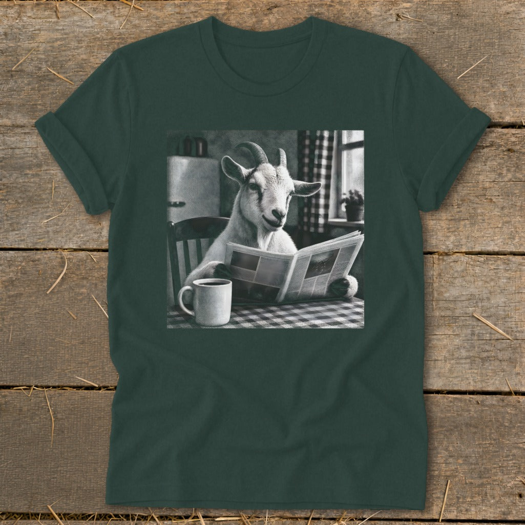 Dark green t-shirt featuring a black and white graphic of a goat reading a newspaper at a table with a mug.