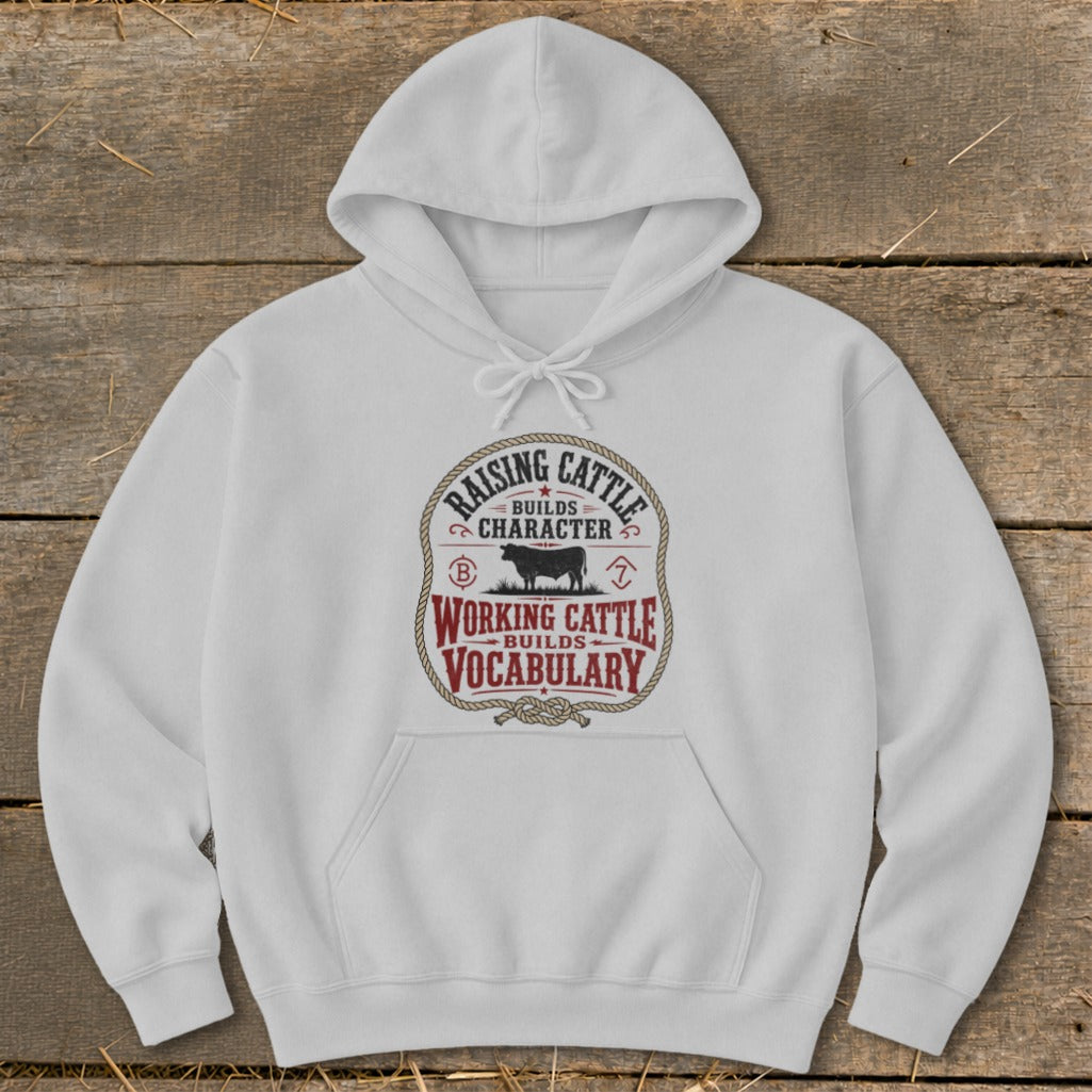 White hoodie with "Raising Cattle Builds Character" and "Working Cattle Builds Vocabulary" text.