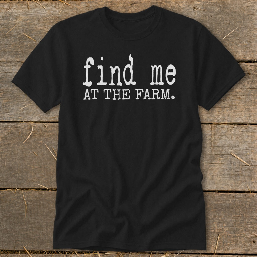 Black t-shirt with white text that says "find me AT THE FARM."