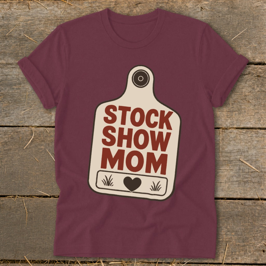 Maroon t-shirt with "STOCK SHOW MOM" text inside a cow tag graphic.