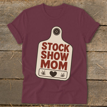 Maroon t-shirt with "STOCK SHOW MOM" text inside a cow tag graphic.