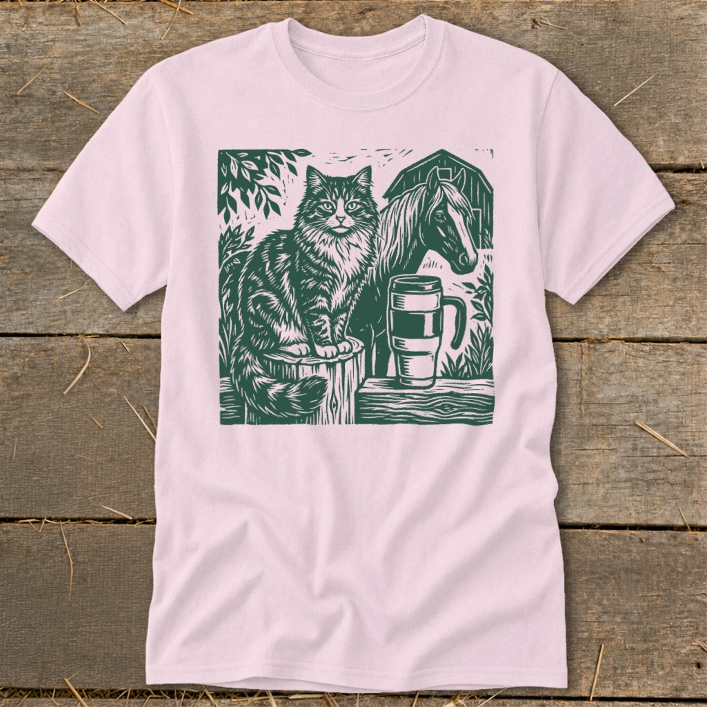 Green linocut of a cat and horse with a mug next to a barn.