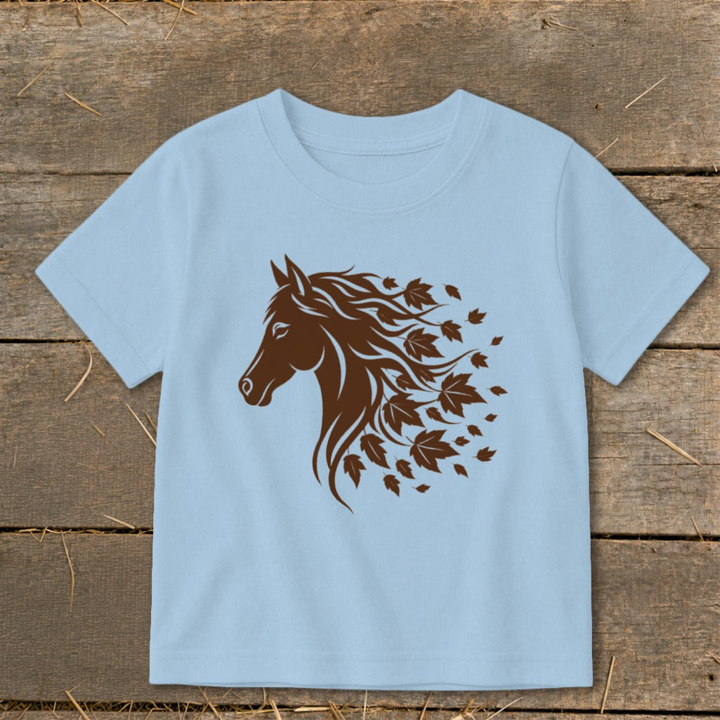 Light blue t-shirt with a brown horse head graphic with flowing mane of leaves.