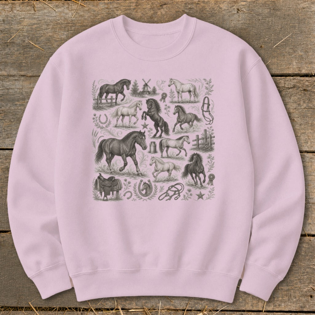 Light pink sweatshirt with a collage of horse illustrations and equestrian items.