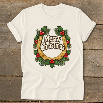 Cream t-shirt with a horseshoe and holly wreath graphic that says "Merry Christmas".