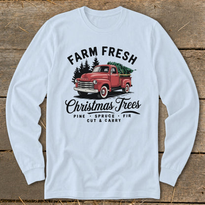 Long sleeve shirt with a red truck carrying Christmas trees, "Farm Fresh Christmas Trees" text.