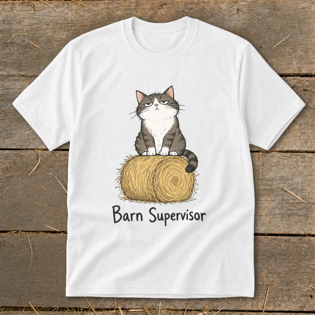 White t-shirt with a cartoon cat sitting on a hay bale with text "Barn Supervisor".