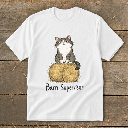 White t-shirt with a cartoon cat sitting on a hay bale with text "Barn Supervisor".
