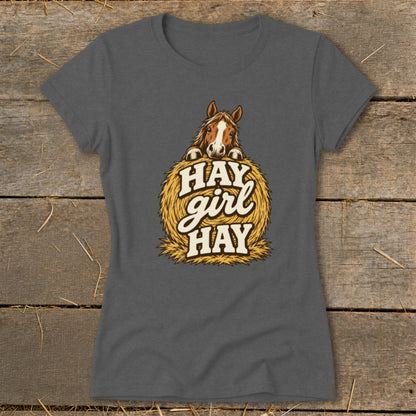 Horse peeking over hay bale with text "HAY girl HAY" on grey t-shirt.