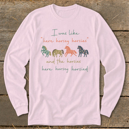 Pink long-sleeve shirt with graphic: "I was like 'here horsey horsies' and the horsies here horsey horsied"