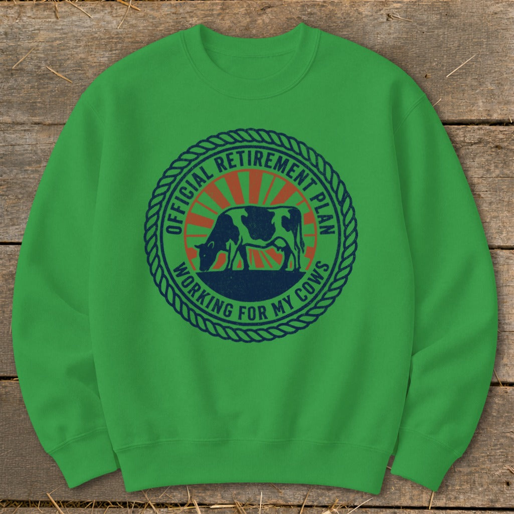 Green sweatshirt with "Official Retirement Plan Working for My Cows" text and cow graphic.