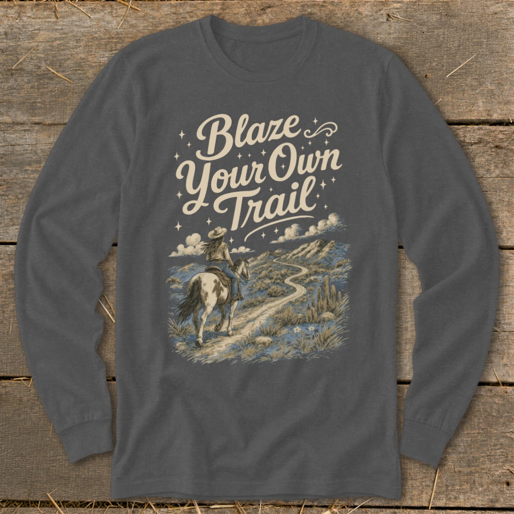 "Blaze Your Own Trail" text with woman riding horse on desert path.