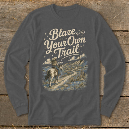 "Blaze Your Own Trail" text with woman riding horse on desert path.