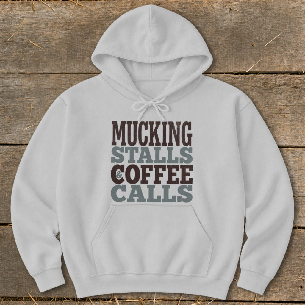 White hoodie with "Mucking Stalls & Coffee Calls" text graphic.
