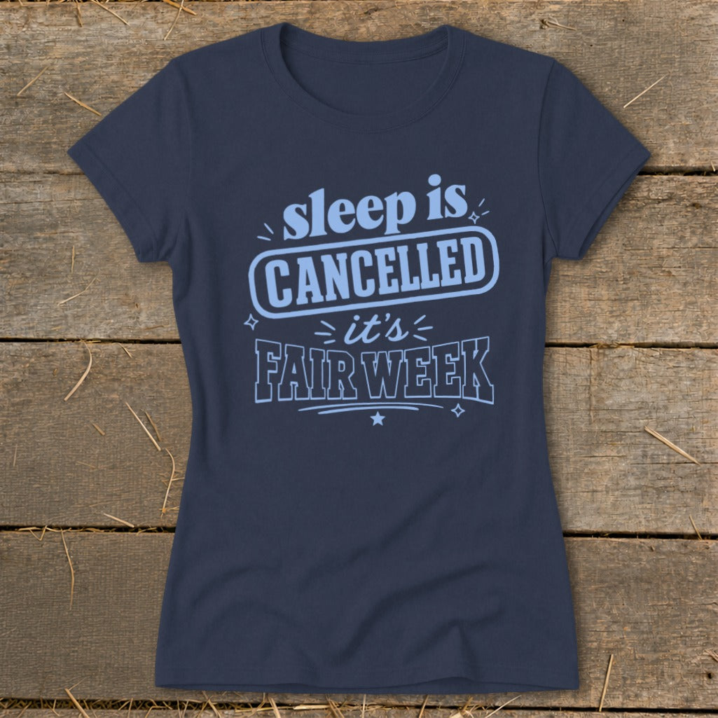 Navy t-shirt with "sleep is CANCELLED it's FAIR WEEK" text.