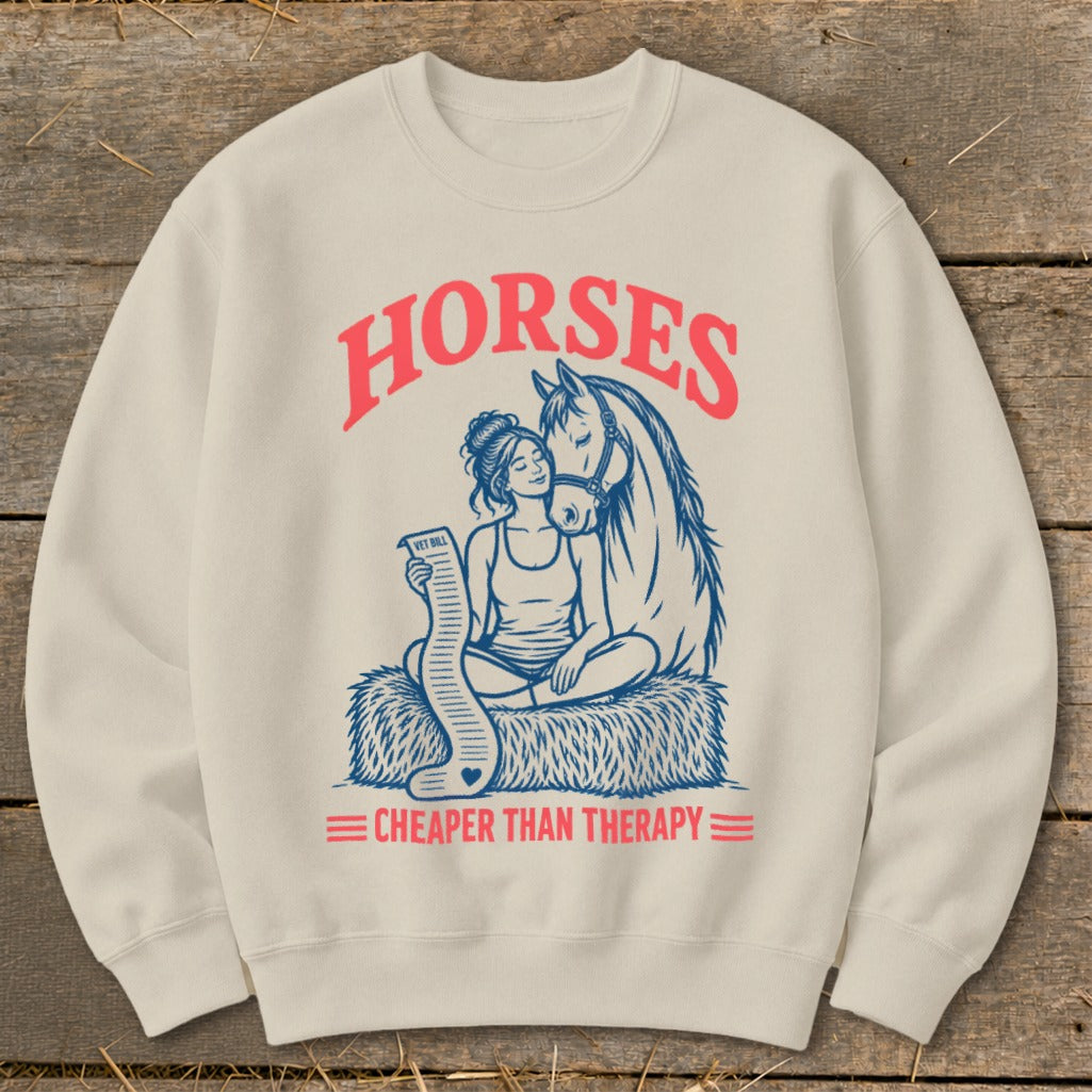 Cream sweatshirt with "Horses" and "Cheaper Than Therapy" text and horse and woman graphic.