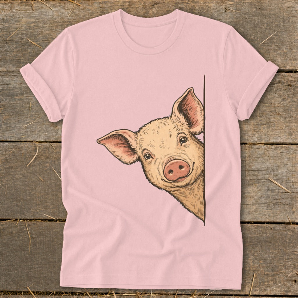 Pink t-shirt with a drawing of a smiling pig peeking from the side.