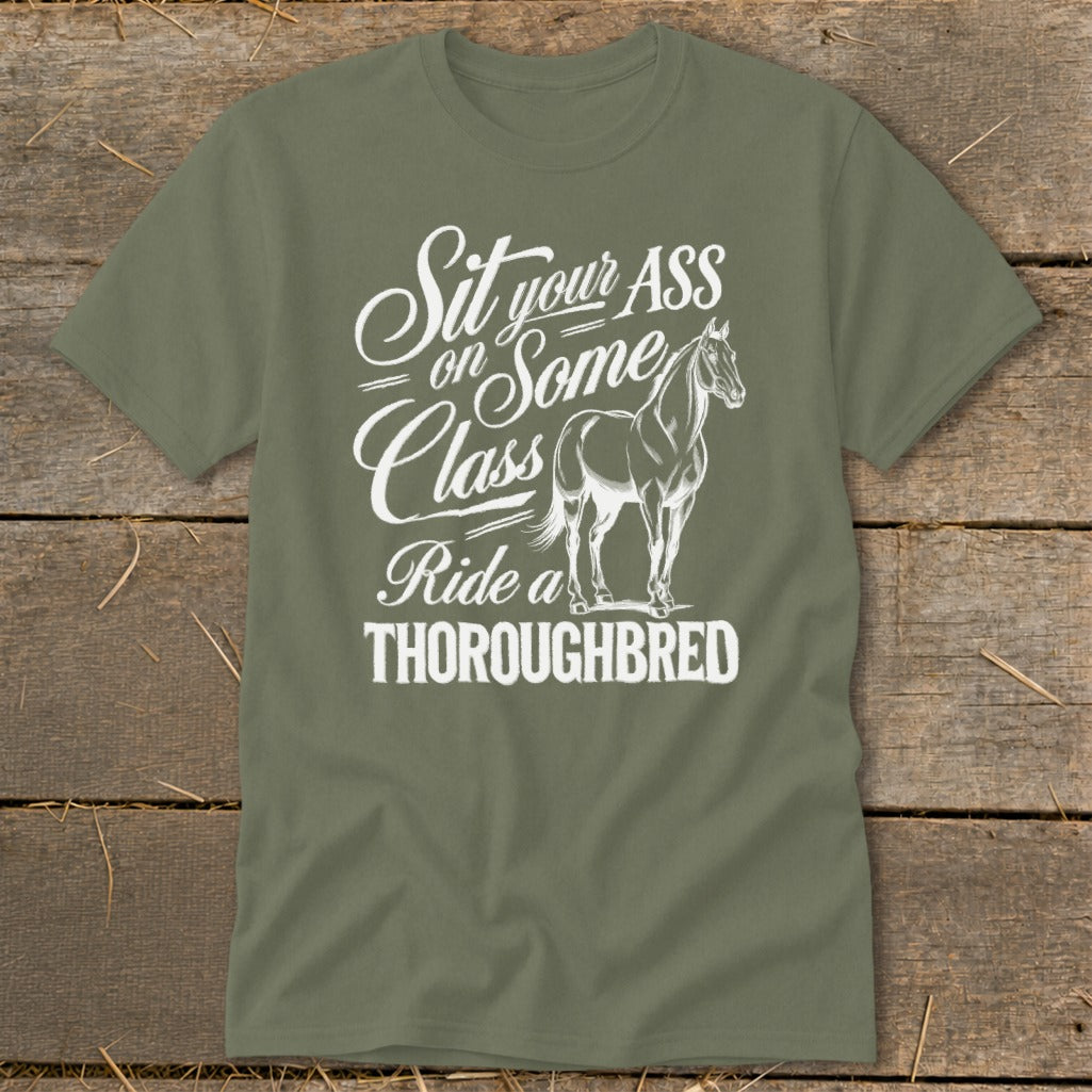 Olive green t-shirt with white text and a horse graphic reading "Sit your ASS on Some Class Ride a THOROUGHBRED".