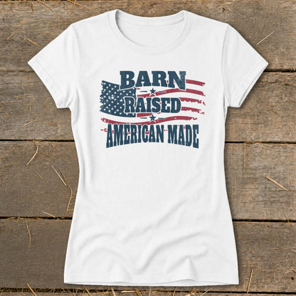 White t-shirt with distressed American flag graphic and text: "BARN RAISED AMERICAN MADE".