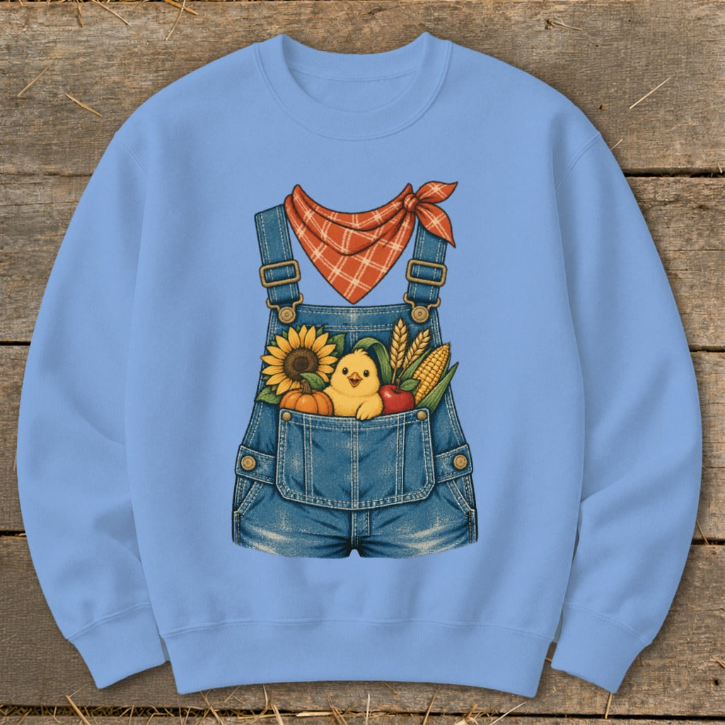Light blue sweatshirt with a denim overall design featuring a chick and fall harvest elements.