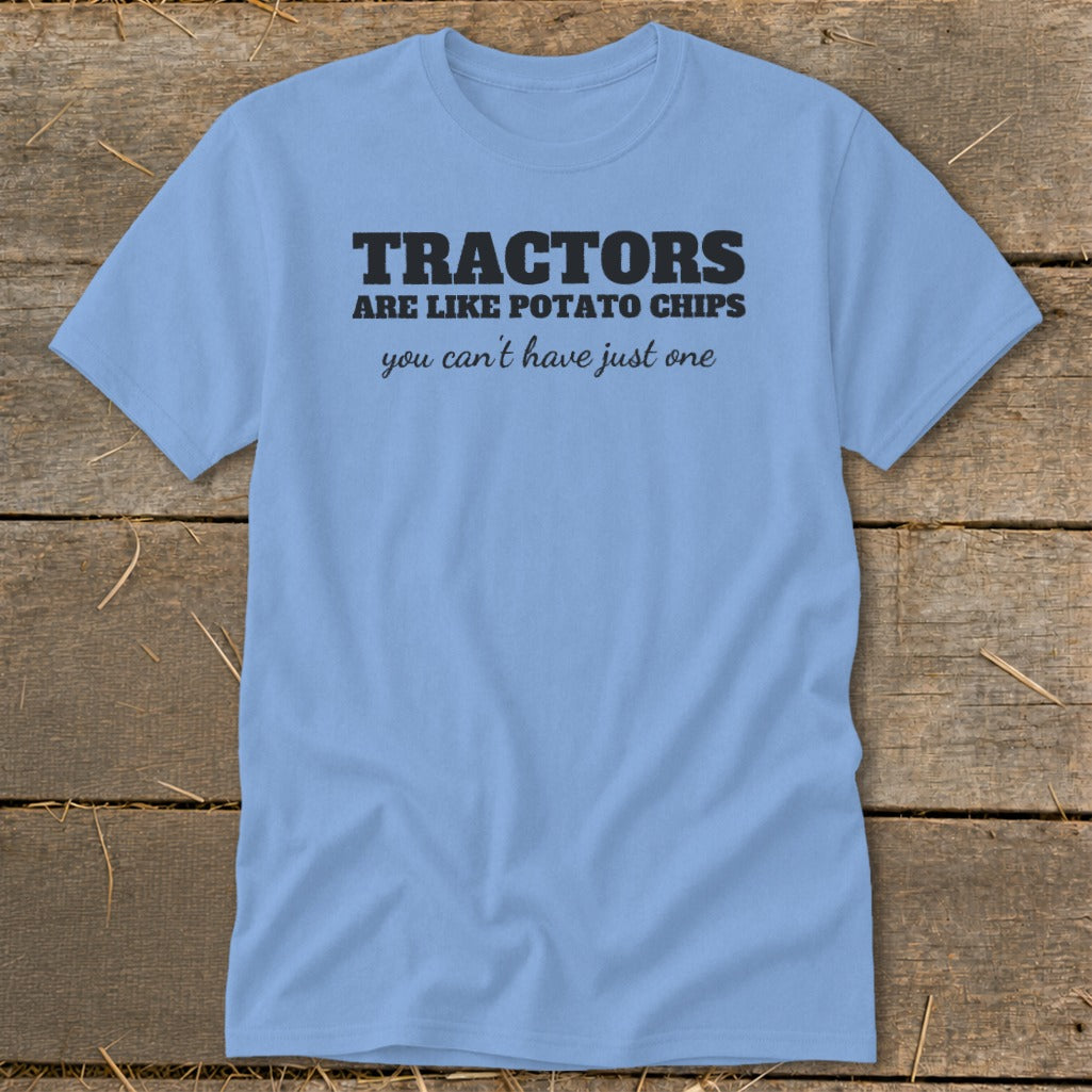Light blue t-shirt with black text reading "TRACTORS ARE LIKE POTATO CHIPS you can't have just one".