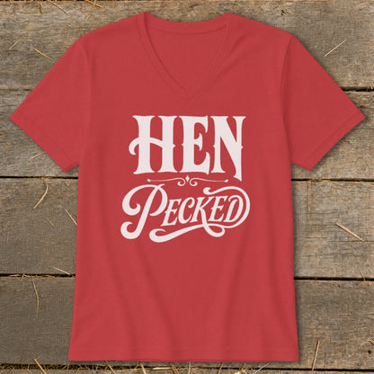 Red v-neck t-shirt with white "HEN Pecked" text and decorative swirls.