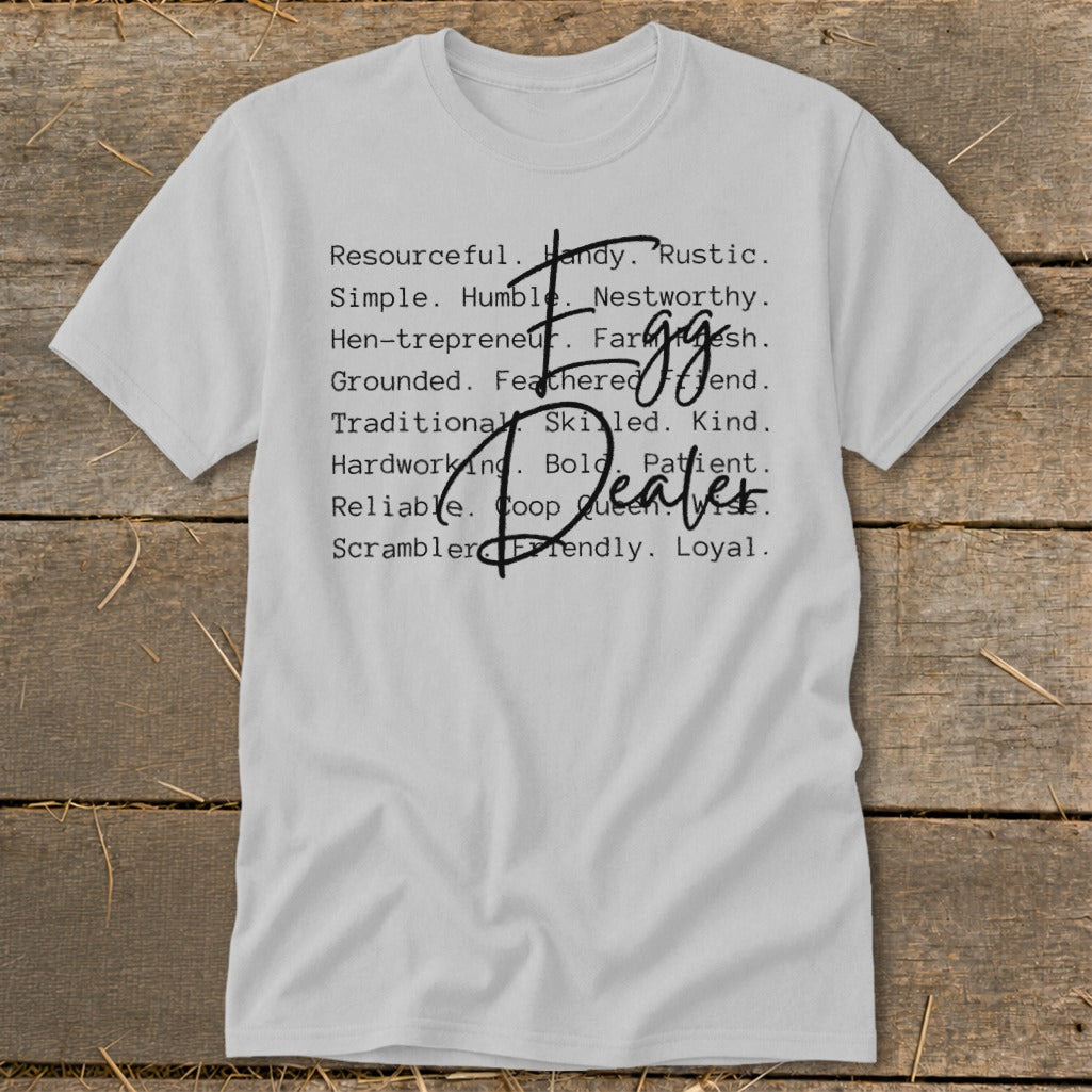 White t-shirt with text listing attributes like "Resourceful," "Hen-trepreneur," and "Egg Dealer."
