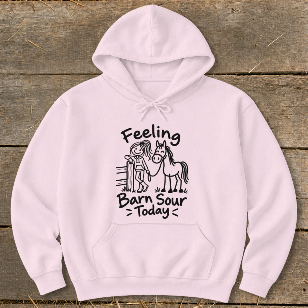 Pink hoodie with stick figure girl and horse graphic and text "Feeling Barn Sour Today".