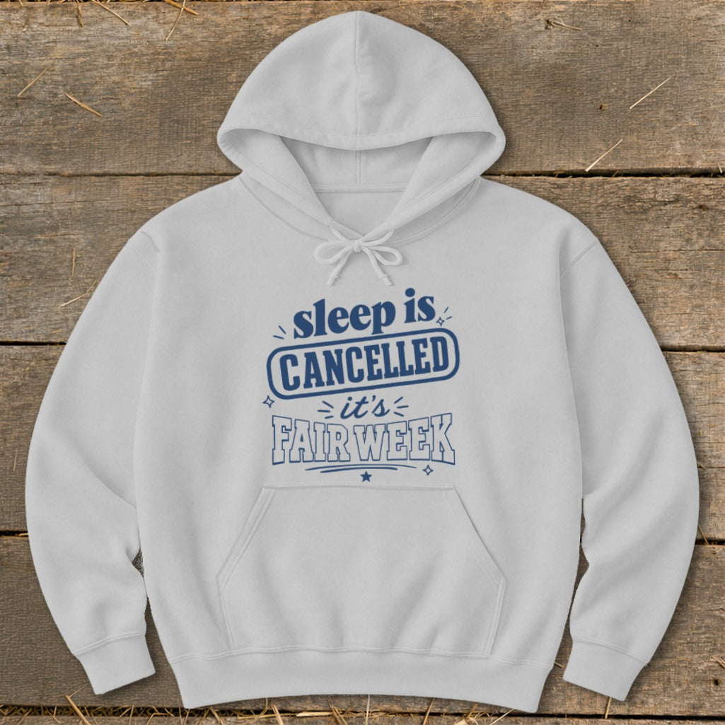 White hoodie with blue text that says "sleep is CANCELLED it's FAIR WEEK".