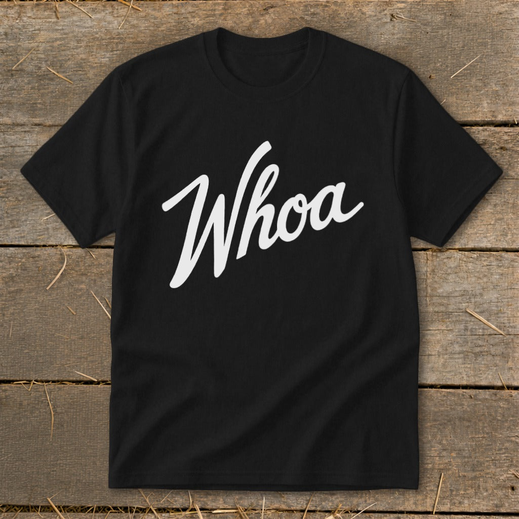 Black t-shirt with "Whoa" in white cursive lettering.