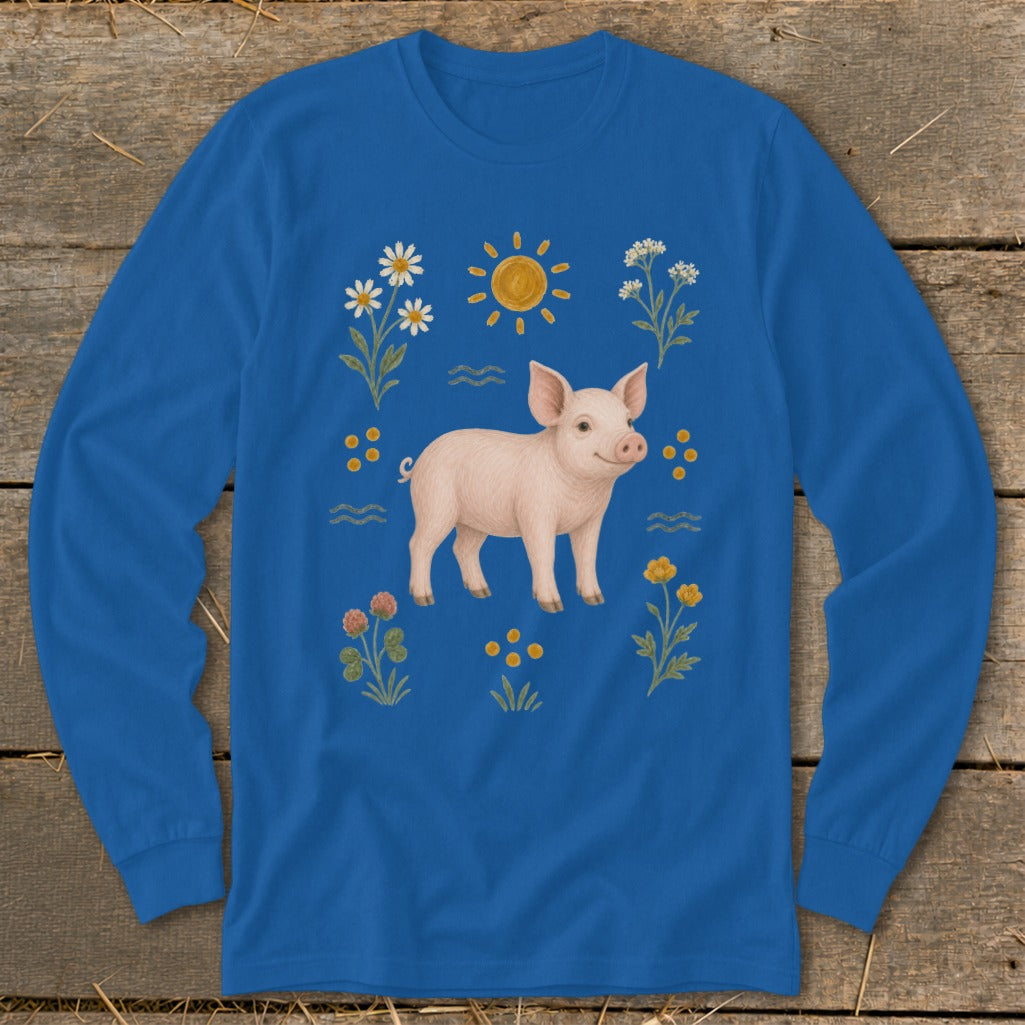 Blue long-sleeved shirt with a pink pig and floral illustrations.