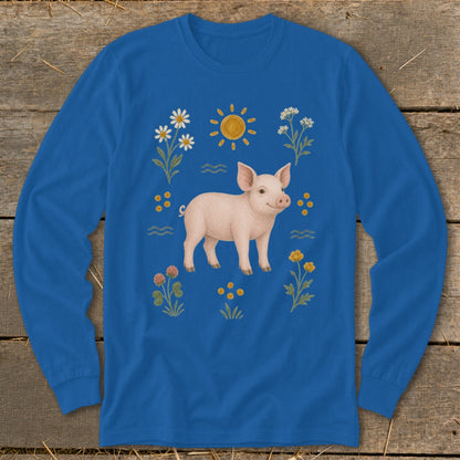 Blue long-sleeved shirt with a pink pig and floral illustrations.