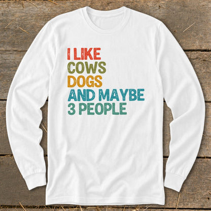 White long-sleeve shirt with distressed text "I like cows, dogs, and maybe 3 people."