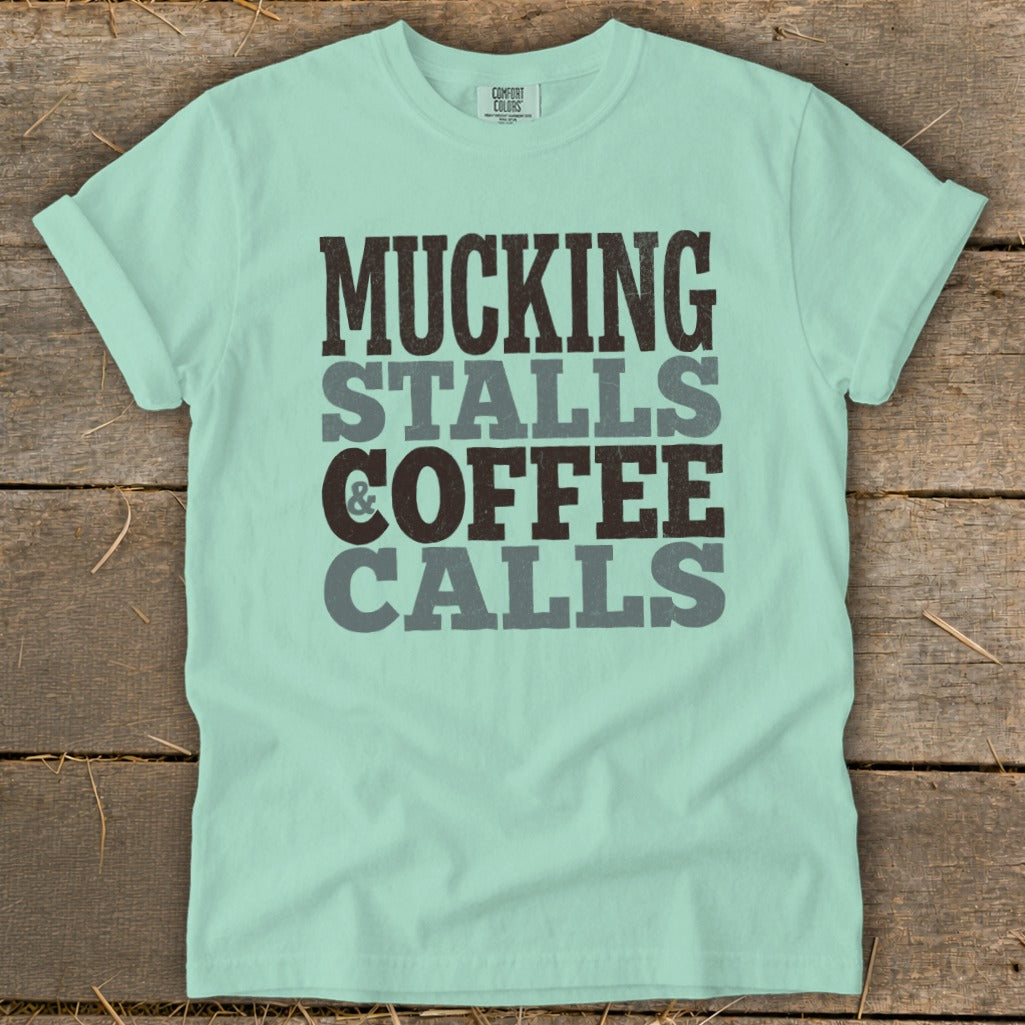 Mint green t-shirt with "Mucking stalls & coffee calls" text.