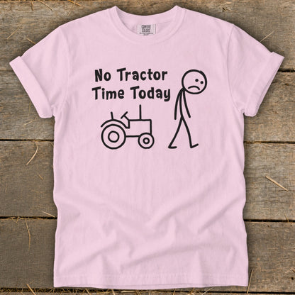 Pink t-shirt with black text and stick figures of a tractor and sad person.