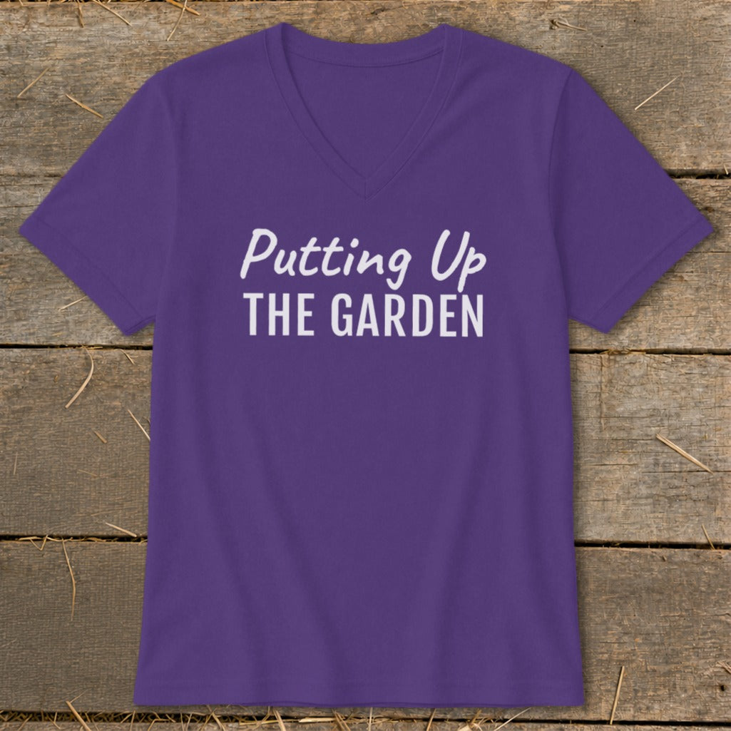 Purple v-neck t-shirt with white text "Putting Up THE GARDEN".