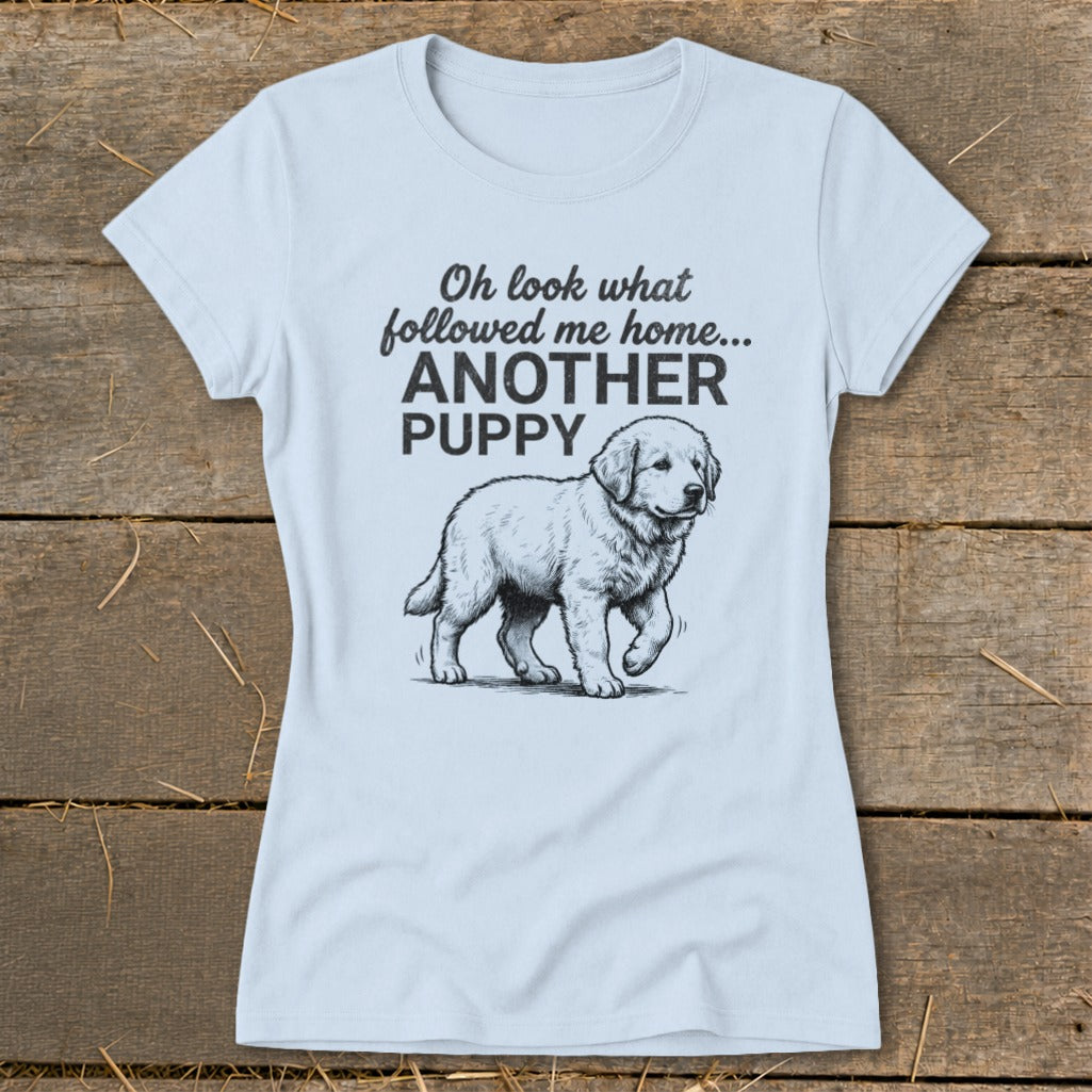 Light blue t-shirt with a sketch of a puppy and the text "Oh look what followed me home... ANOTHER PUPPY".