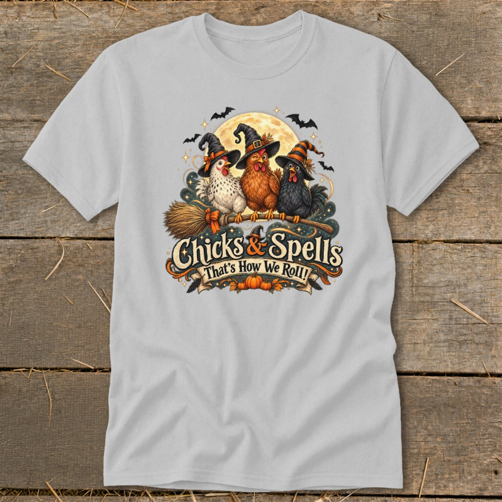 Three chickens in witch hats riding a broomstick with text "Chicks & Spells."