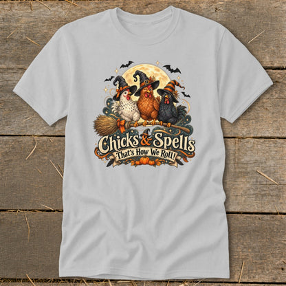 Three chickens in witch hats riding a broomstick with text "Chicks & Spells."