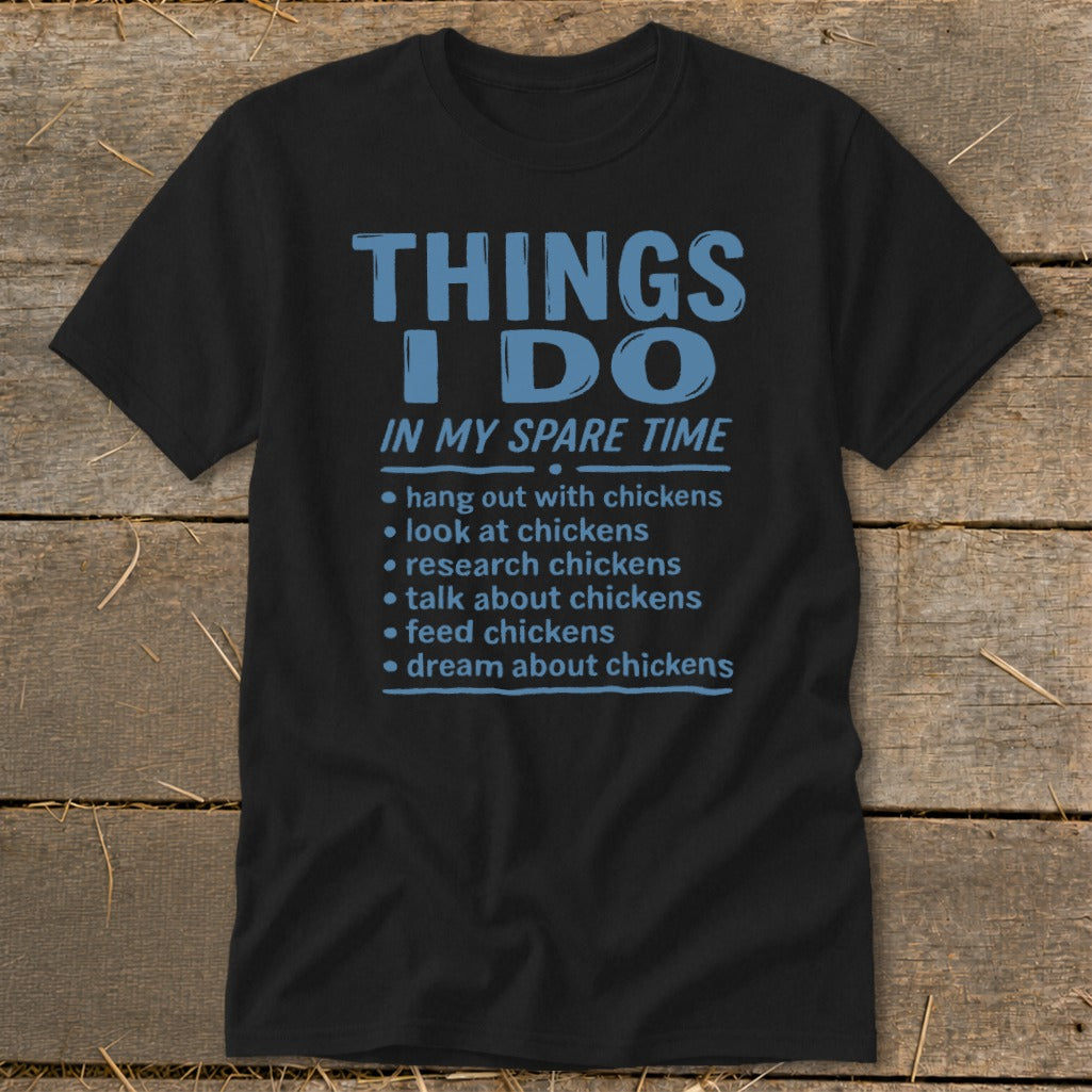 Black t-shirt with blue text listing chicken-related spare time activities.