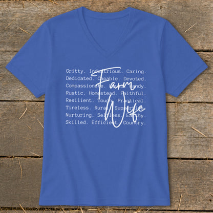 Blue V-neck shirt with white text listing traits of a "Farm Wife".