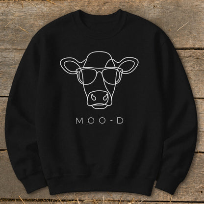 Black sweatshirt with white outline of a cow wearing sunglasses and text "MOO-D".